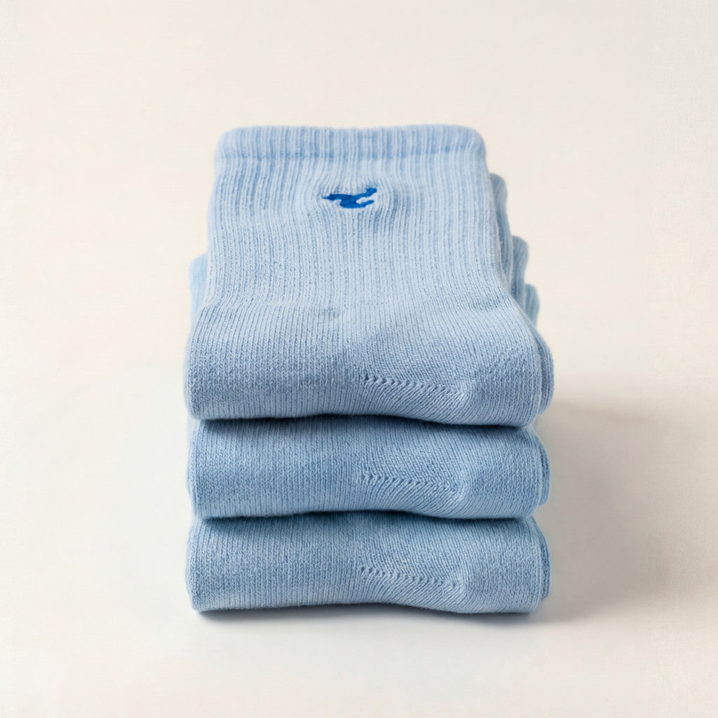Tiny Socks 3-pack in Soft Marina, three pairs folded and stacked.