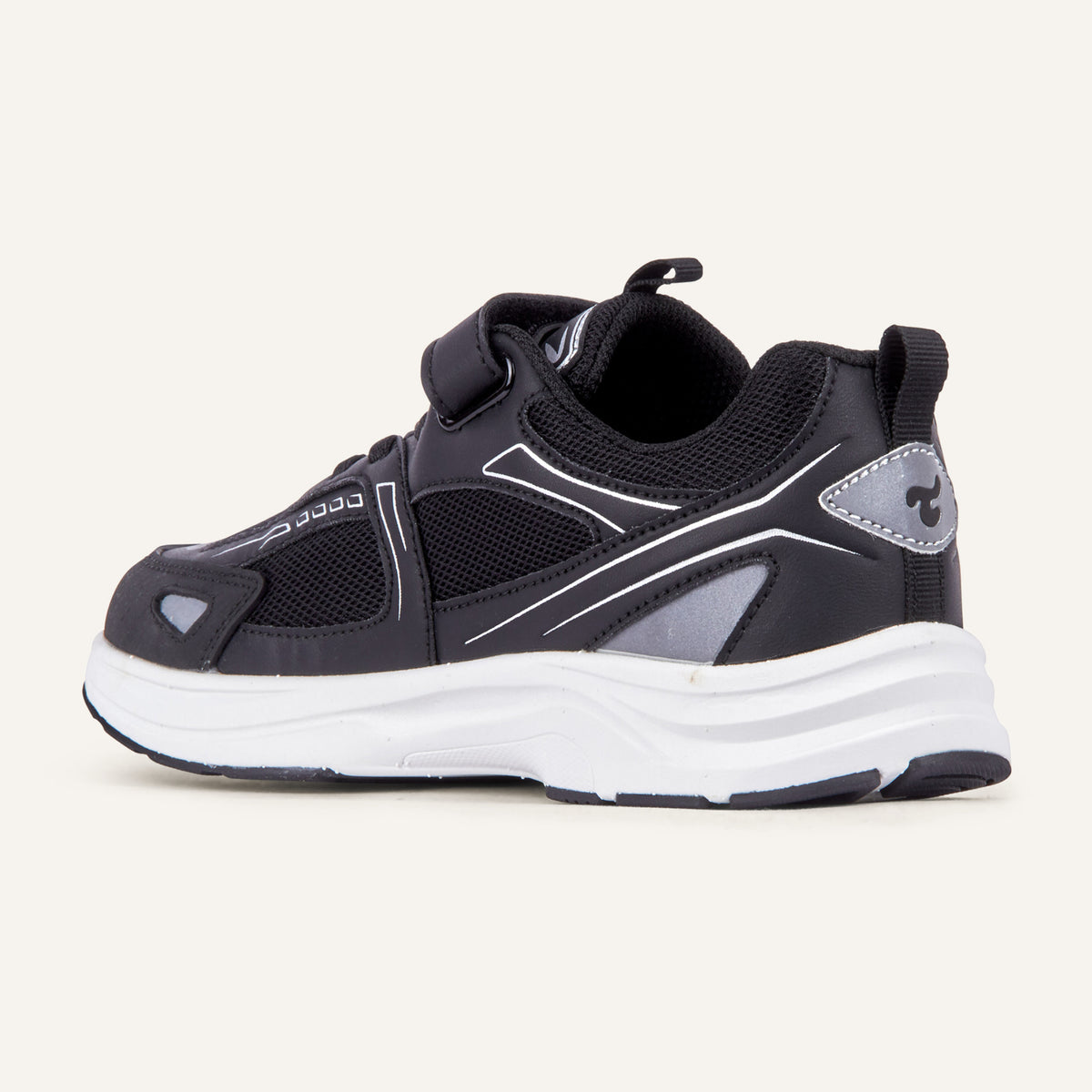 Play Junior in black from the inner side, mesh upper and white sole visible.