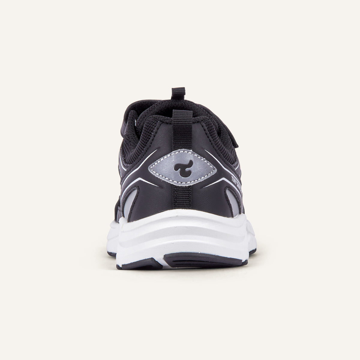 Play Junior in black, rear view with the Tiny Dancers logo on the heel.