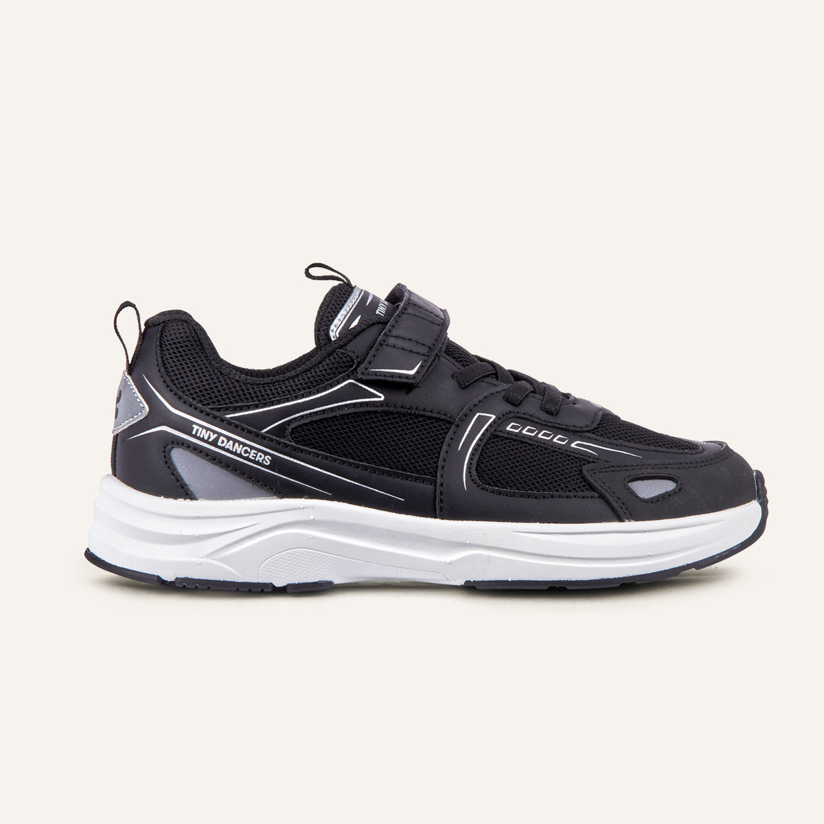 Play Junior in black, side profile with reflective upper and hook-and-loop strap.