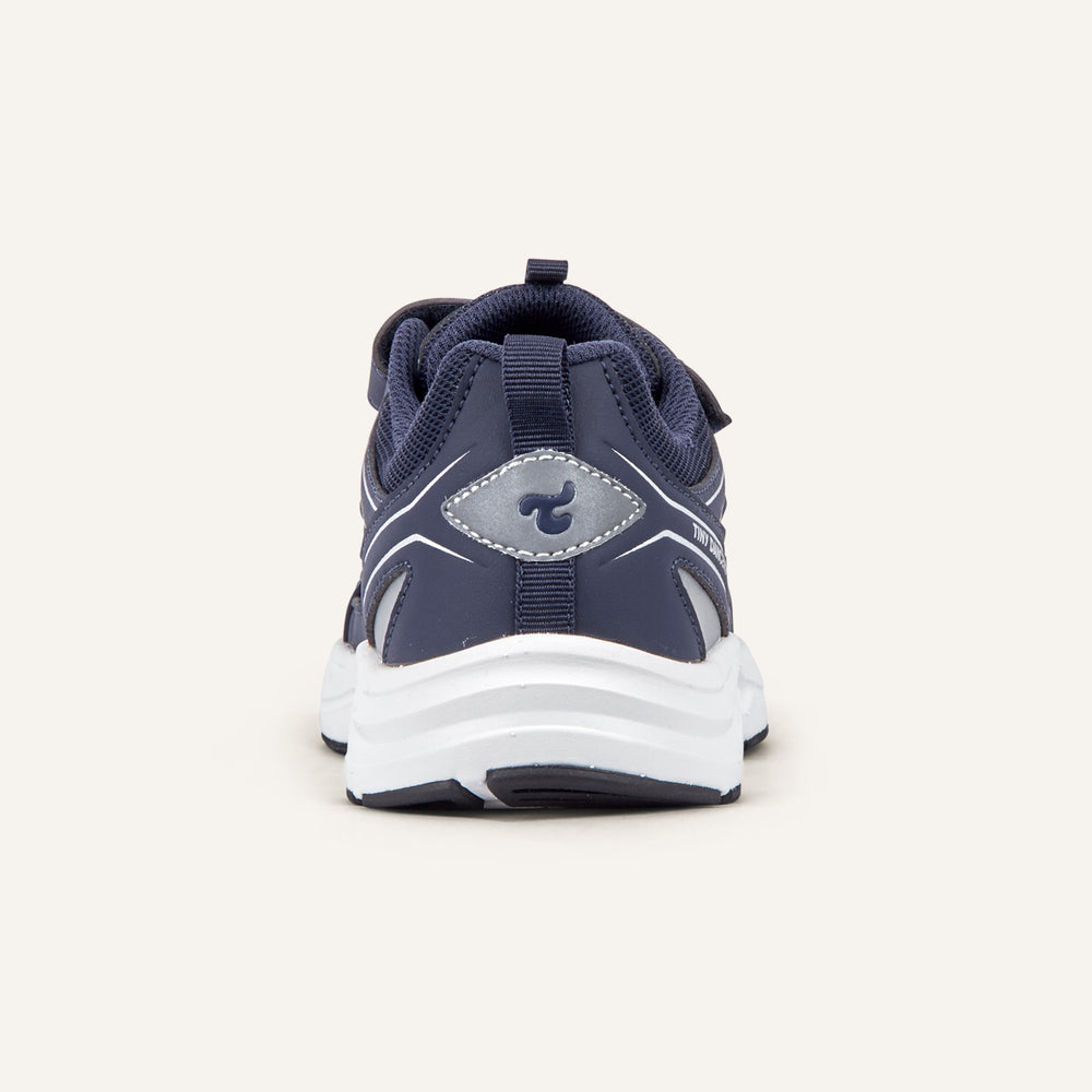 Play Junior in navy, rear view with the Tiny Dancers logo on the heel.