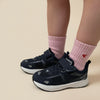 Child wearing Tiny Socks in Barely Pink with Play Junior shoes.