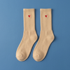Tiny Socks 3-pack in Sugar Swizzle, a pair laid flat on a blue background.