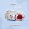 Play Infant in silver pink from above, labelled: foot-shaped toe box, flexible level soles, cuttable velcro, elastic laces, rubber mudguard.