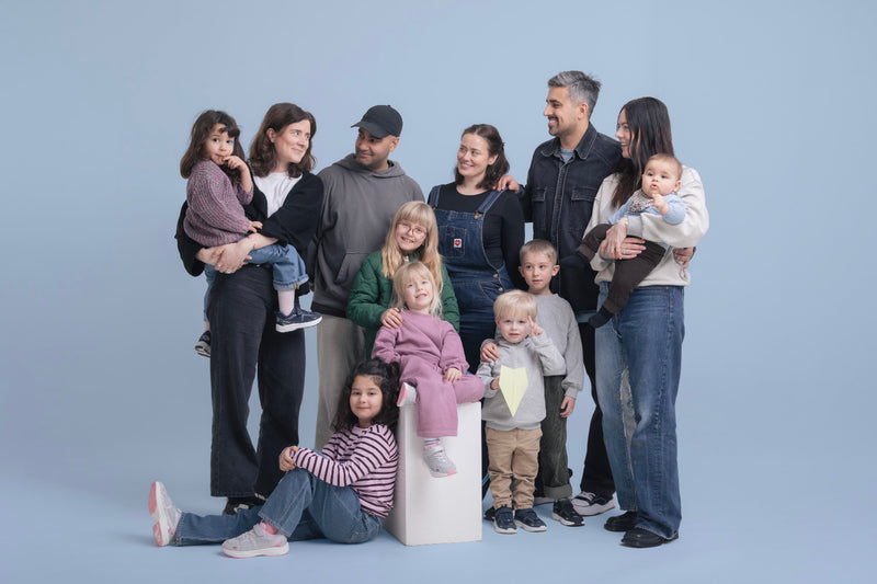 The Tiny Dancers co-founders and their families, photographed together in a Copenhagen studio.