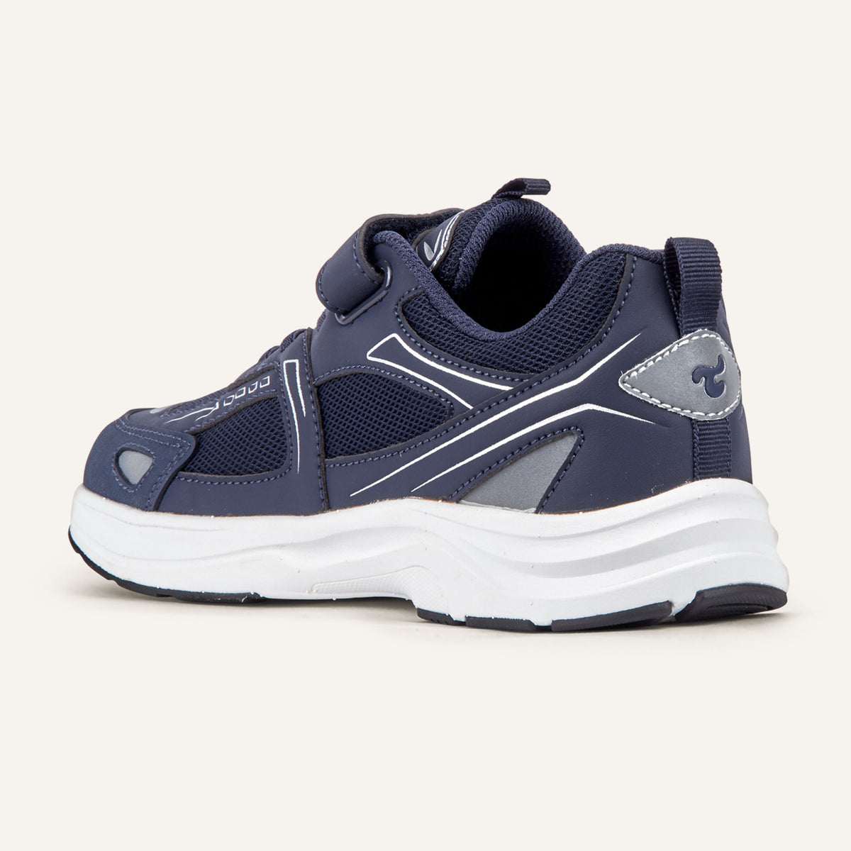 Play Junior in navy from the inner side, mesh upper and white sole visible.
