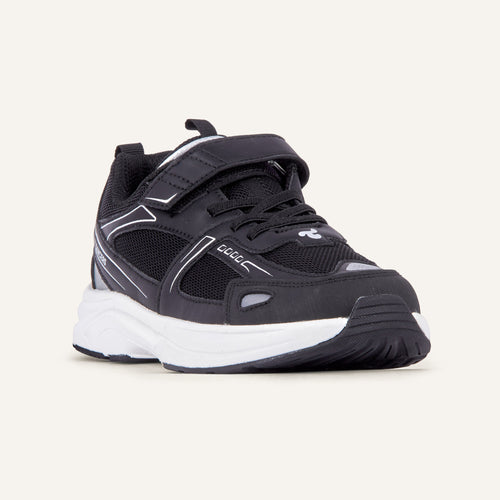 Play Junior in black, angled front view showing the strap and mesh upper.