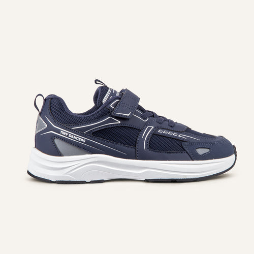 Play Junior in navy, side profile showing the strap and reflective upper.